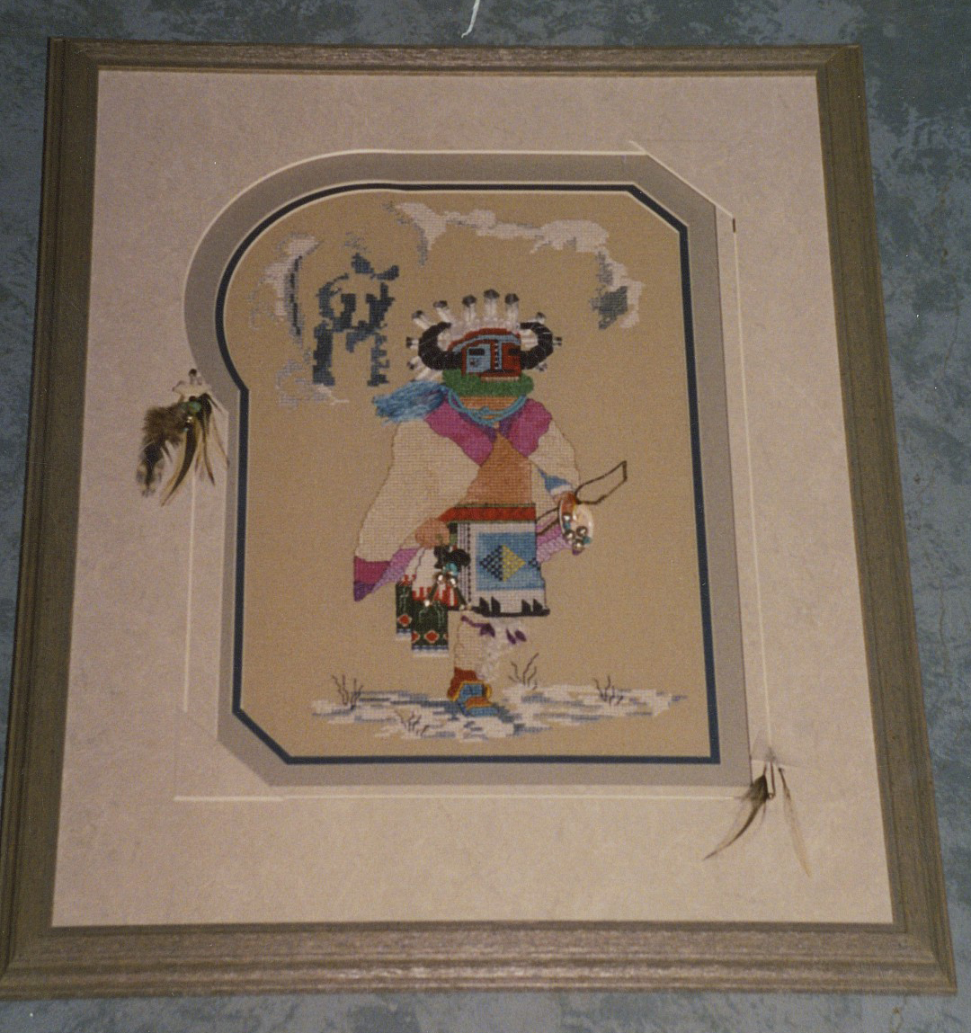 Barnwood grey frame on Native American Kachina with special cut mat with bead and feather embellishments